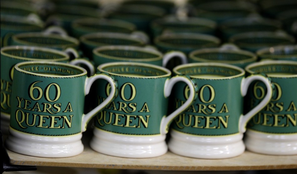 Mugs from the Diamond Jubilee Collection stand on a shelf at the Emma Bridgewater pottery factory in Stoke-On-Trent