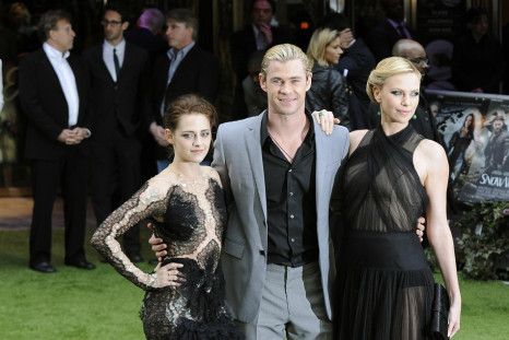 Actors Stewart, Hemsworth and Theron pose for photographers as they arrive for the world premiere of &quot;Snow White and the Huntsman&quot; at Leicester Square in London