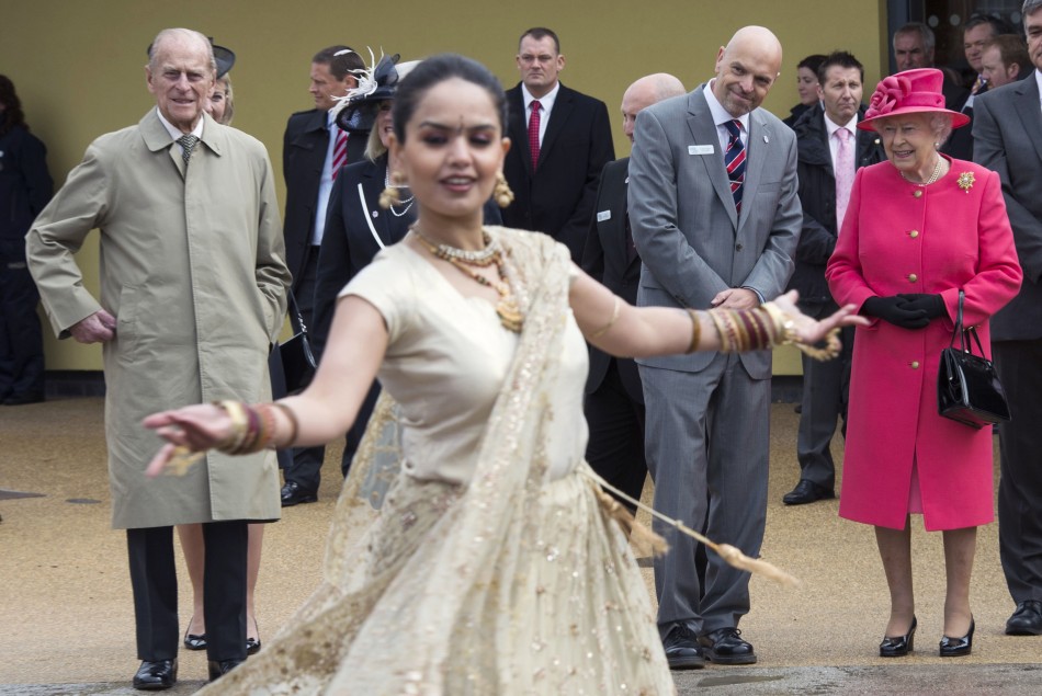Britain039s Queen Elizabeth and Prince Philip watch a dancer during a visit to the Chester Zoo in northern England