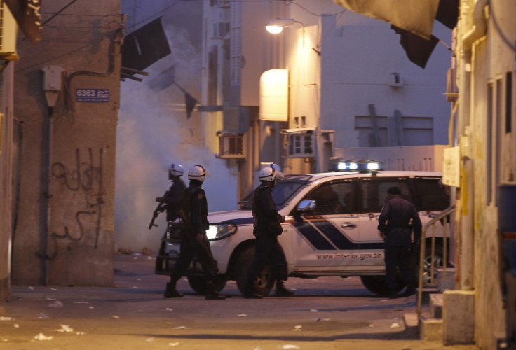 Riot police is seen patrolling the streets during clashes in the village of Bilad al-Qadeem, west of Manama