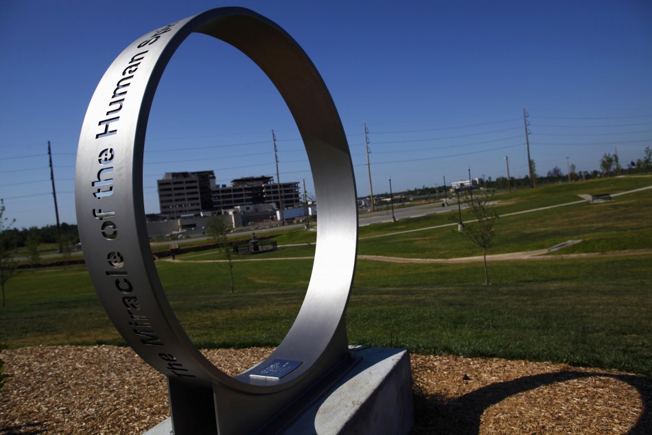 St. John039s Regional Medical Center is seen through part of a memorial to victims of a deadly tornado in Joplin