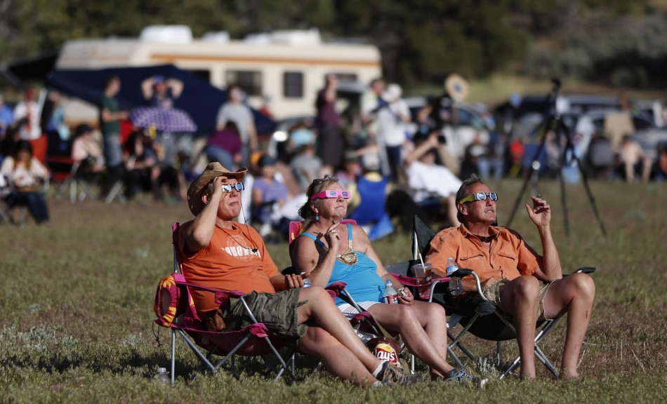 People watch a rare annular eclipse dims the sky, as the sun and moon align for quotring of firequot spectacle over the southwestern town of Kanarraville, Utah