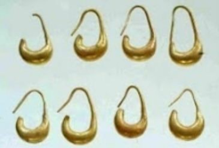 Four pair of moon-shaped gold earrings were also found in the vessel. (Photo: The Megiddo Expedition)