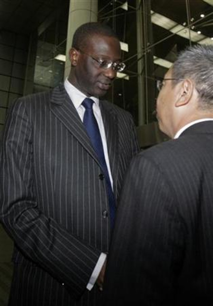 Prudential&#039;s CEO Tidjane Thiam shakes hands with local Prudential staff member after meeting with Prudential employees at a convention centre in Singapore