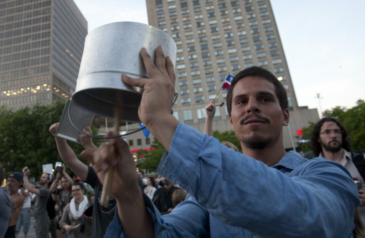Students strike pots and pans as they take part in protest march against tuition fee hikes in Montreal