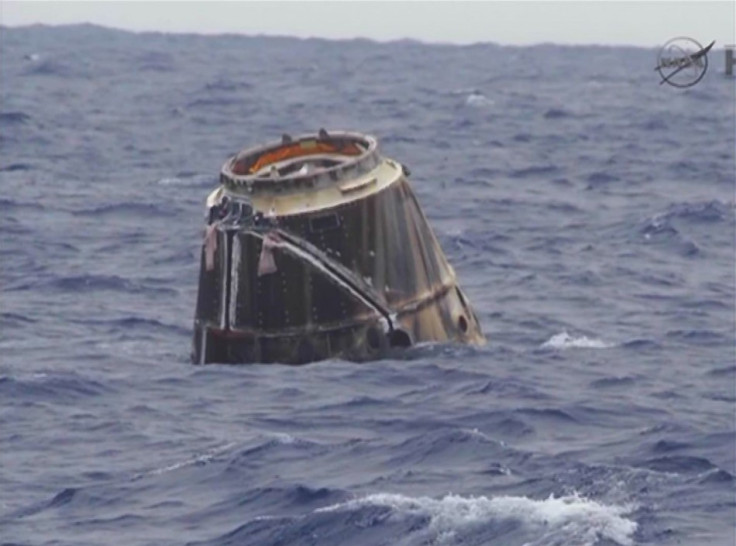 SpaceX Dragon capsule floats in the Pacific Ocean off of Baja, California (Reuters/Nasa)