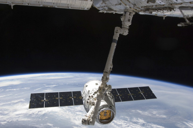 The SpaceX Dragon commercial cargo craft is seen as it is grappled by the International Space Station's Canadarm2 (Reuters/Nasa) The SpaceX Dragon commercial cargo craft is seen as it is grappled by the International Space Station's Canadarm2 (Reuters/Nasa)
