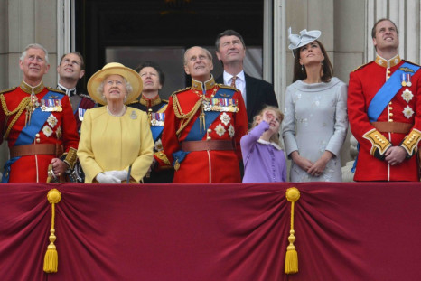 Members of Britain&#039;s Royal family watch a flypast by the Red Arrows as they stand on the balcony of Buckingham Palace following the Trooping the Colour ceremony in central London