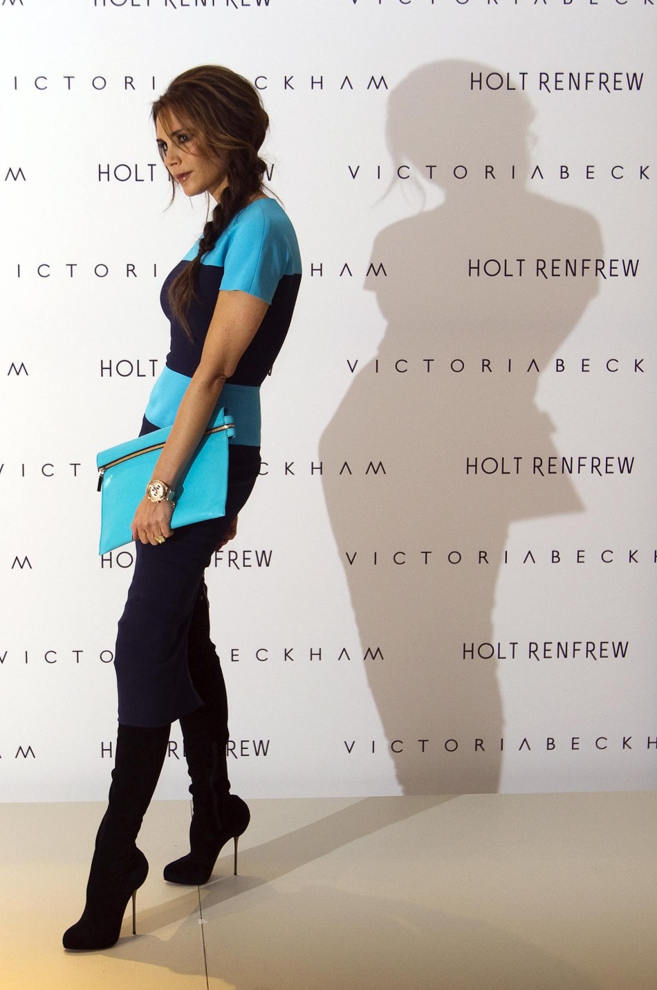 Victoria Beckham poses for the media and fans at Holt Renfrew Vancouver while in town prompting her fashion line in Vancouver