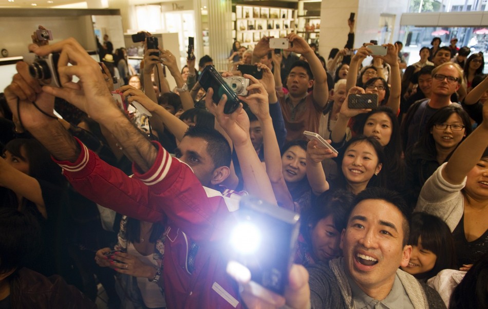 Fans greet Victoria Beckham at Holt Renfrew Vancouver as she promotes her fashion line in Vancouver