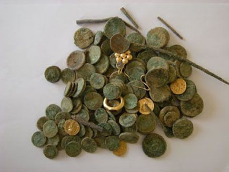 The gold and silver coins that were discovered during an excavation of a building dating to the Roman and Byzantine period in Israel. (Photo: Israel Antiquities Authority)
