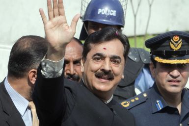 Pakistan's Prime Minister Yusuf Raza Gilani waves after arriving at the Supreme Court in Islamabad
