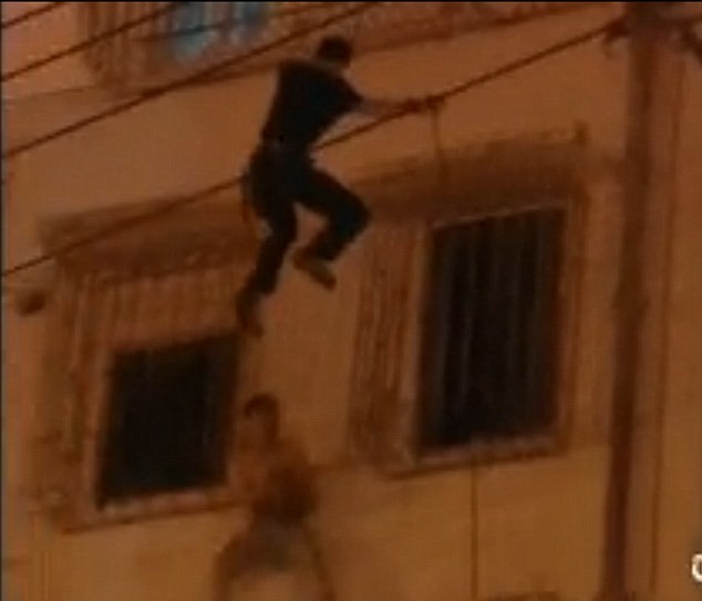 Abseiling Police Officer stops Man committing suicide