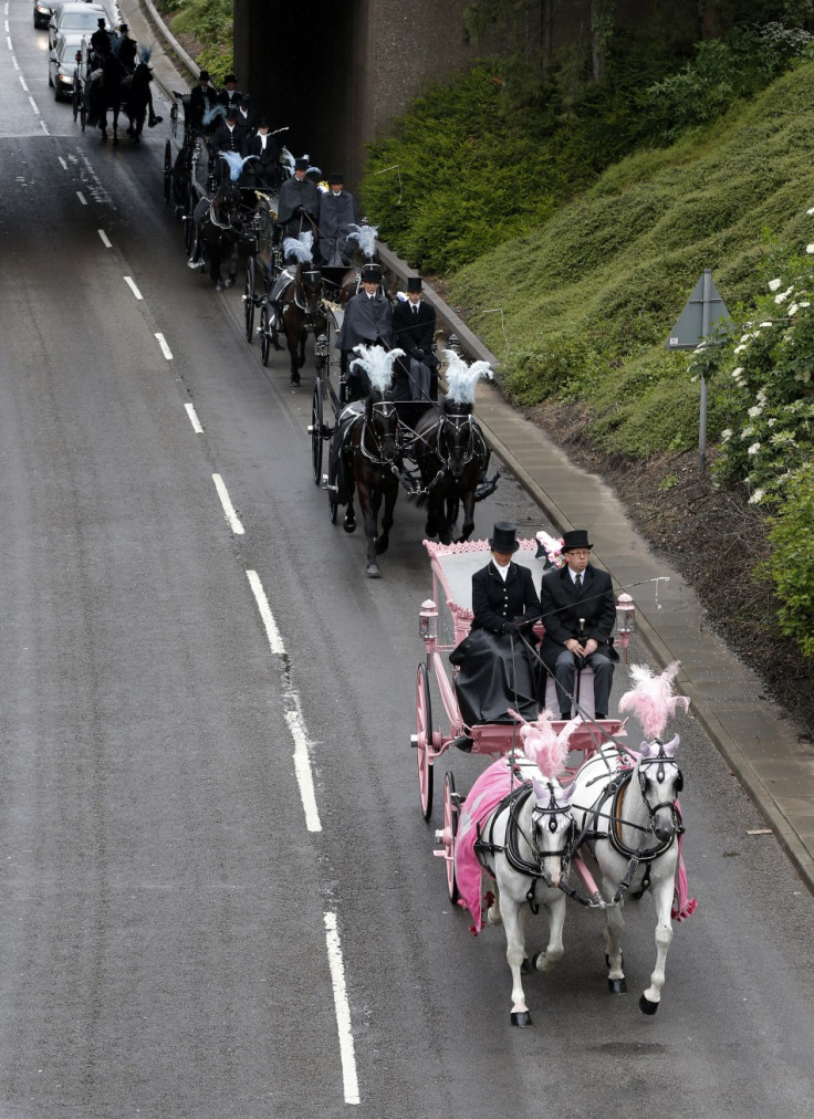 The coffins were taken to the church through Derby via horse drawn hearses (Reuters)
