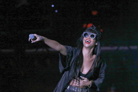 Rihanna performs, during a surprise appearance with Jay Z, at the Hackney Weekender festival at Hackney Marshes in east London