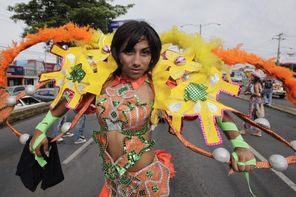 A member of the LGBT community takes part in a gay pride parade in Managua