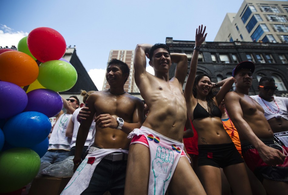 People dance during the Gay Pride parade in Toronto