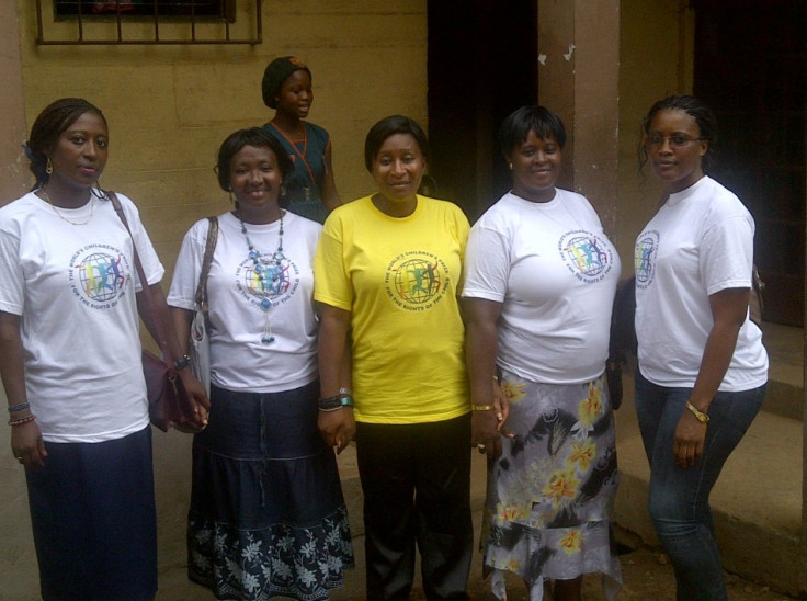 Anita Koroma, country director for Girl Child Network Sierra Leone, with members of her team