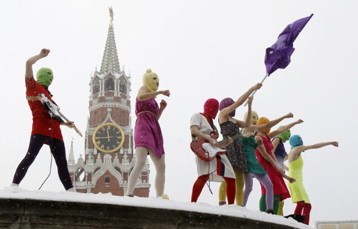The three members of Pussy Riot are charged with hooliganism after singing an anti-Vladimir Putin song in a Russian church (Reuters)