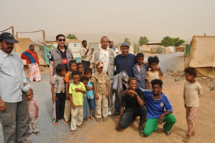 Habib Anam is to the left, wearing dark glasses and a dark T shirt. He is in the refugee camp in Aradh town, Hajjah City, north Yemen