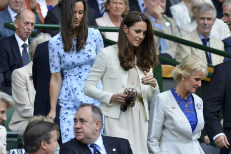 Britain's Catherine, Duchess of Cambridge arrives with her sister Pippa Middleton on Centre Court at the Wimbledon Tennis Championships in London