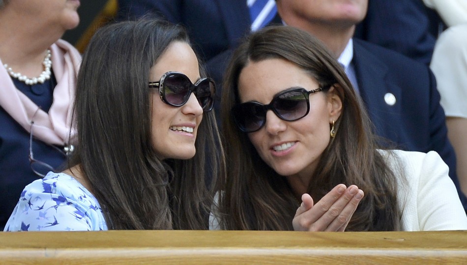Britains Catherine, Duchess of Cambridge sits with her sister Pippa Middleton on Centre Court at the Wimbledon Tennis Championships in London