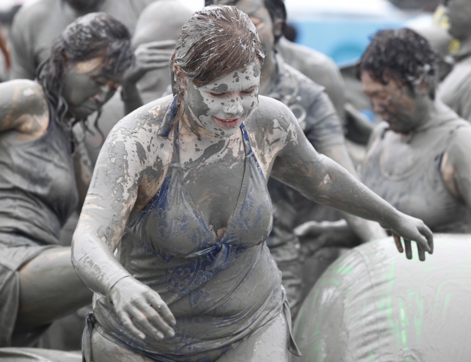 People play in mud during the Boryeong Mud Festival at Daecheon beach in Boryeong