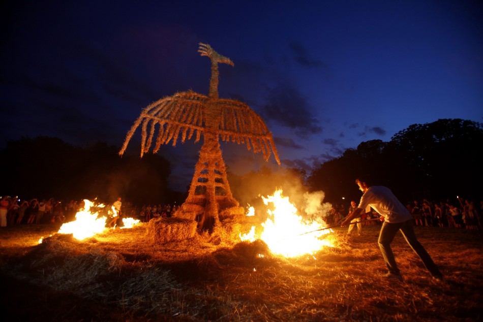 Artists burn a straw art installation during the 7th Straw - Land Art Festival in Osijek