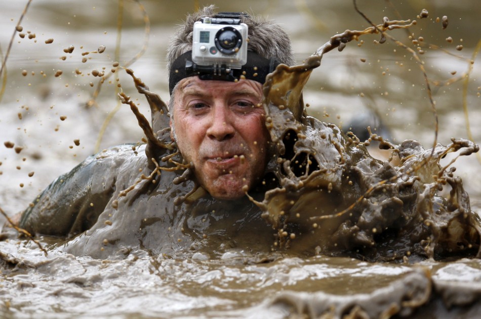 A competitor wears a camera on his head as he competes in the Tough Mudder at Mt. Snow in West Dover
