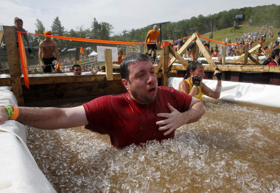 A competitor reacts after jumping into a vat of ice water during the Tough Mudder at Mt. Snow in West Dover