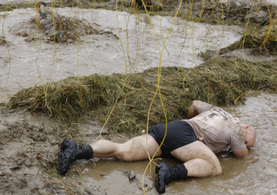 A competitor reacts after being zapped by an electrified wire during the Tough Mudder at Mt. Snow in West Dover A competitor reacts after being zapped by an electrified wire during the Tough Mudder at Mt. Snow in West Dover