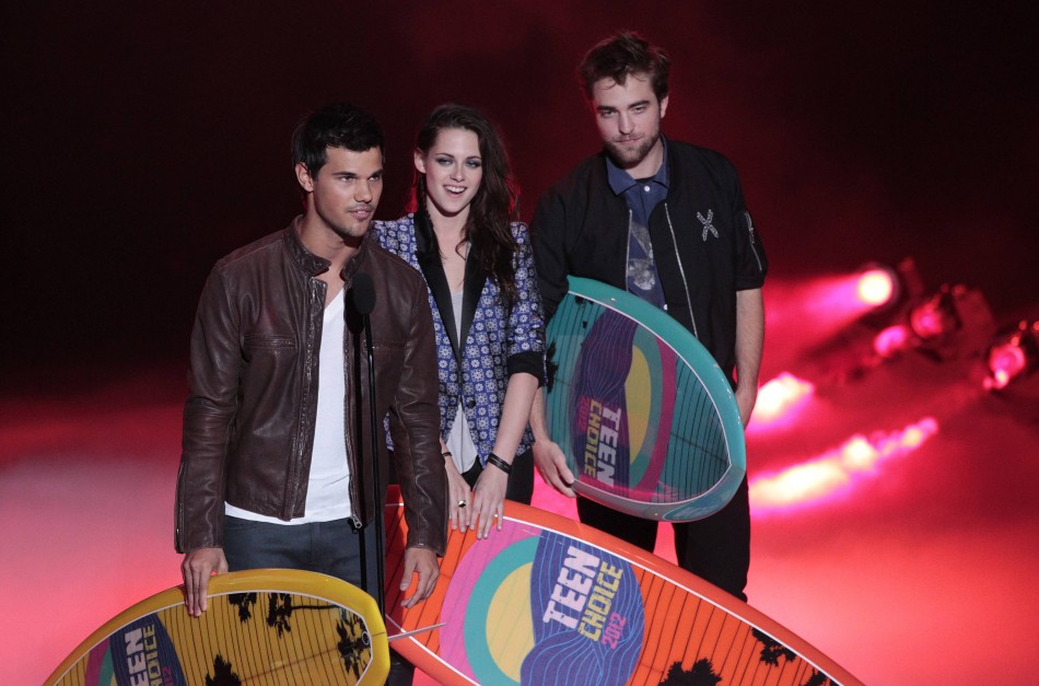 Lautner, Stewart, Pattinson accept the Ultimate Choice Award at the Teen Choice Awards at the Gibson amphitheater in Universal City