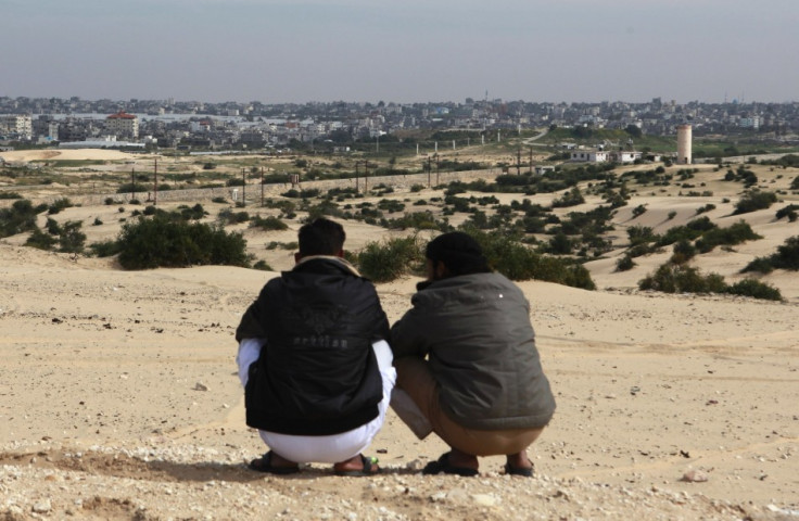 Bedouins squat over a hilly area overlooking Gaza, in Rafah city, north Sinai,