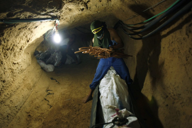 Palestinian smuggler prepares scrap metal to be exported to Egypt through a tunnel in Rafah, Reuters