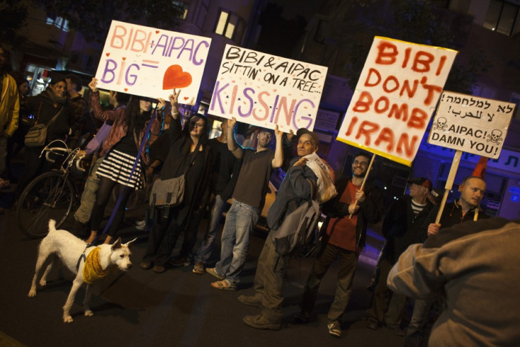 Israelis hold placards as they protest against a possible attack of Iran's nuclear facilities, in Tel Aviv, Reuters