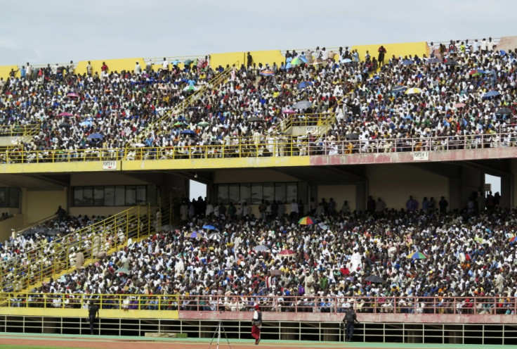 People take part in a rally for peace at the March 26 stadium in Bamako, Reuters