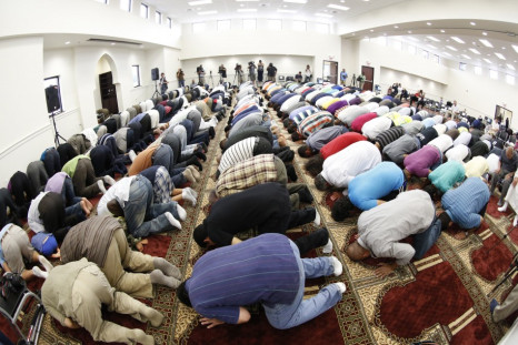 Musims pray in a mosque