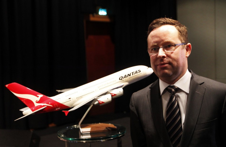 Qantas posts full-year loss