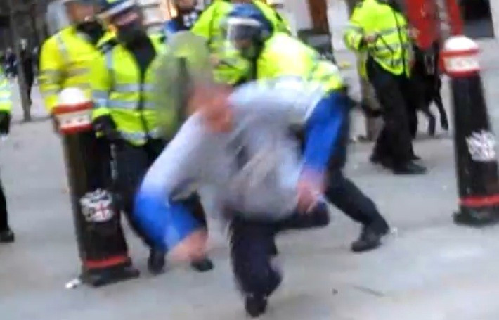 Ian Tomlinson flew to the ground after PC Simon Harwood struck him across the legs with a baton, video footage revealed at the G20 protests in central London (YouTube) Ian Tomlinson flew to the ground after PC Simon Harwood struck him across the legs with a baton, video footage revealed at the G20 protests in central London (YouTube)