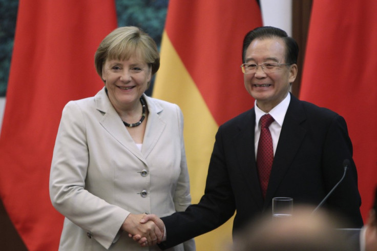 German Chancellor Angela Merkel shakes hands with China&#039;s Premier Wen Jiabao in Beijing
