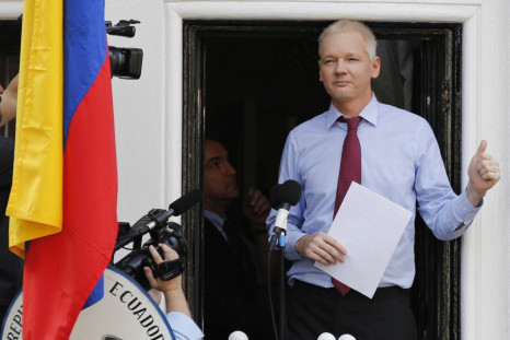 Wikileaks founder Julian Assange gestures as he appears to speak from the balcony of Ecuador's embassy in London