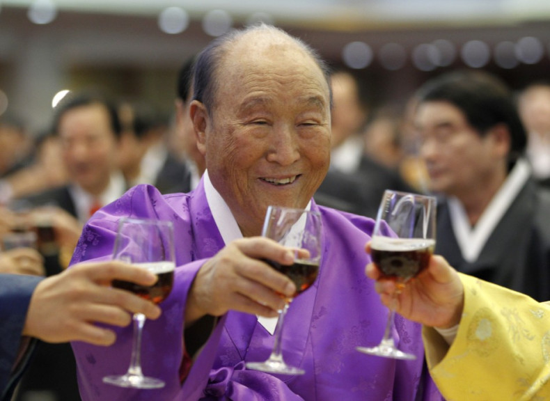 Evangelist Reverend Moon drinks a toast with his family members during his birthday party in Gapyeong