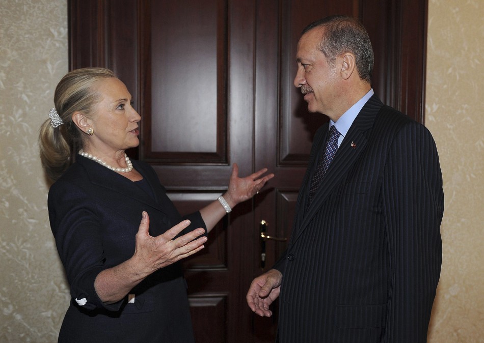 Turkey's Prime Minister Erdogan talks with U.S. Secretary of State Clinton before their meeting