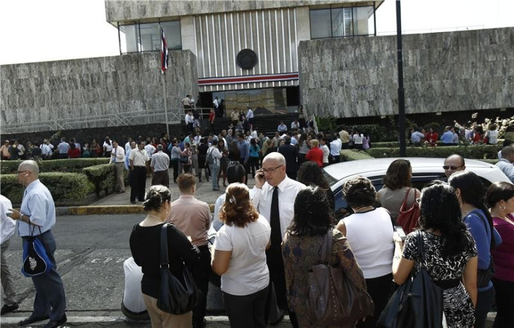 People gather in front of the Supreme Court, after being evacuated from their buildings following an earthquake in San Jose (Reuters)