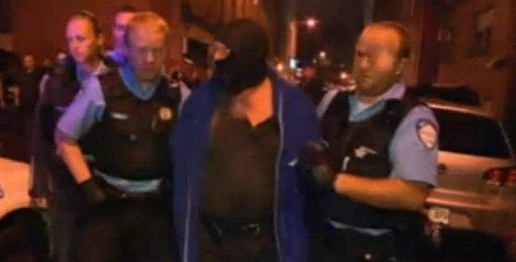 TV pictures showed the alleged gunman being arrested (BBC)