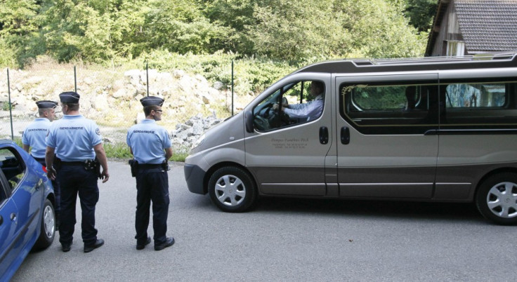 French gendarmes escort hearses leaving La Combe d'Ire raoad in Chevaline