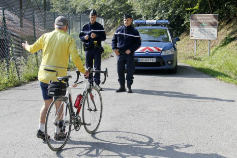 French gendarmes block access to a road to La Combe d'Ire in Chevaline