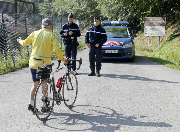 French gendarmes block access to a road to La Combe d'Ire in Chevaline