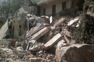 A collapsed house is seen after two earthquakes in Zhaotong, Yunnan province (Reuters)