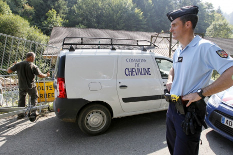 French gendarmes block access to a road to La Combe d'Ire in Chevaline